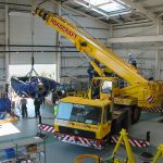Crane being used to manoeuvre large materials