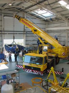 Crane being used to manoeuvre large materials