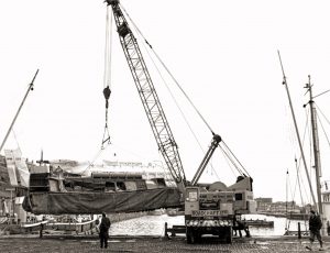 Roadcraft 35t Coles crane lifting a hovercraft at Liverpool docks